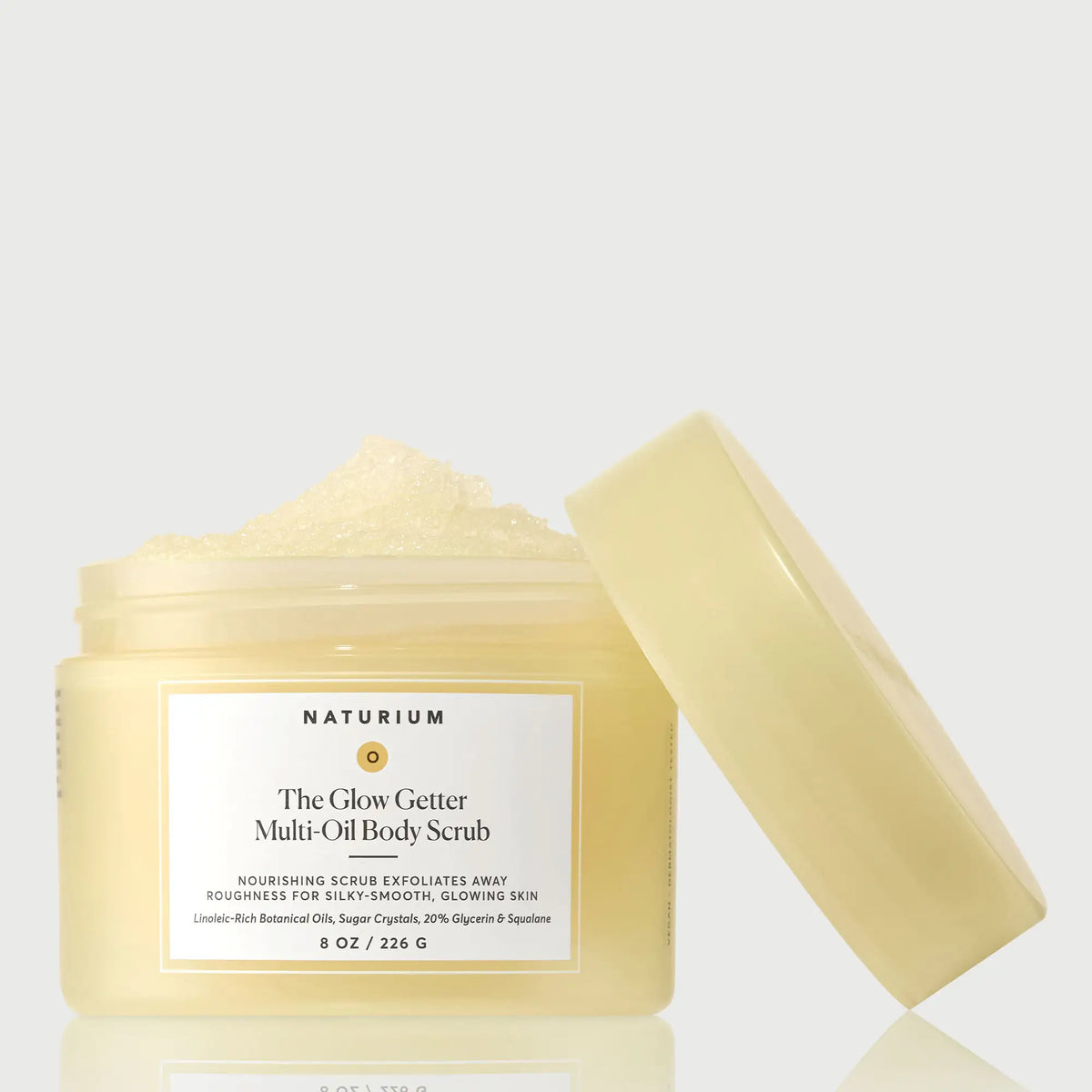 the-glow-getter-multi-oil-body-scrub-m0 NATR-40028-GlowGetter-Multi-Oil-Body-Scrub-Front-CapOff-bonebkgd.webp